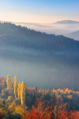 misty sunrise in mountains. wonderful autumn weather. beautiful nature scenery observed from the...