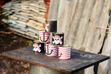 children's party on the subject of Pirates. tin cans with pirates