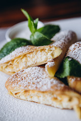 delicious and juicy Russian pancakes with stuffing and sauces served for serving at the restaurant for breakfast