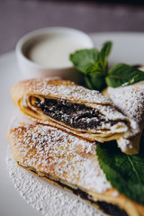 delicious and juicy Russian pancakes with stuffing and sauces served for serving at the restaurant for breakfast