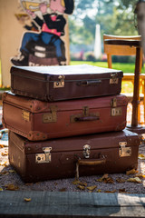 Pile of Vintage Suitcases on the Flea Market