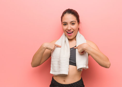 Young fitness woman surprised, feels successful and prosperous