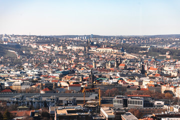 Prague cityscape with churches and train station