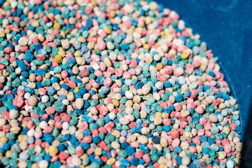 Fototapeta na wymiar chemical felrtilizer closeup - colorful fertilizer granules