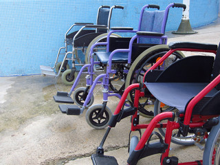 Fototapeta na wymiar Wheelchairs on an accessible beach for transportation of people with disabilities in the water.