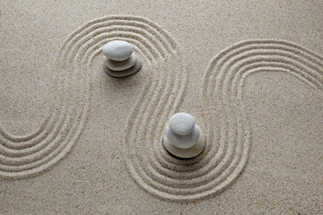 Fototapeta na wymiar Zen garden, stone on sand. Top view