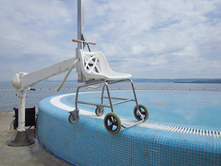 Adapted beach and pool with lift for disabled swimmers.