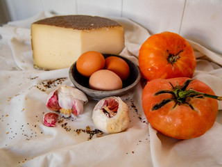 Still life: Cheese, Eggs, Garlic and Tomatoes