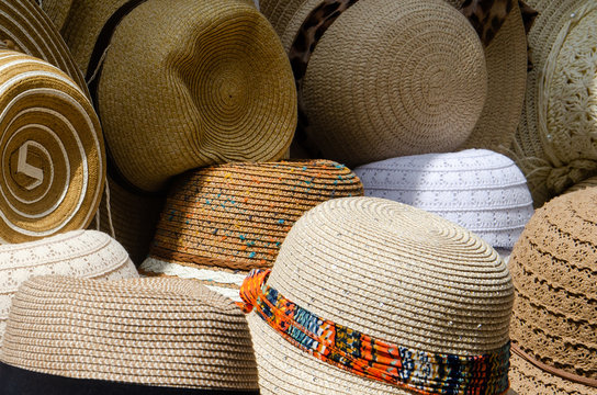 Hats in market shop. straw hats close up
