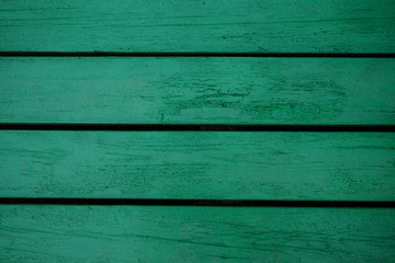 The background of the old painted green boards