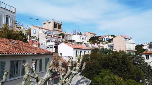 Marseille city, France. Panoramic view on shore village buildings. UHD 4K cinematic stock footage about French Riviera, Mediterranean Coast, South European life, travel, culture.