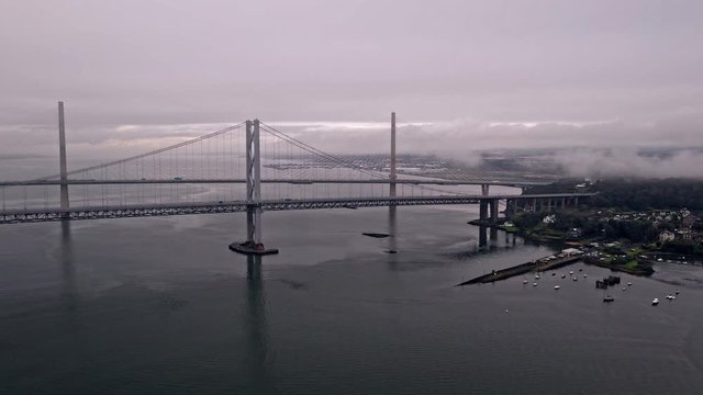 Drone approaching shot of Forth Bridges infrastructure road bridge near Edinburgh Scotland