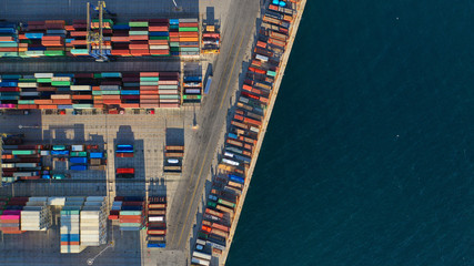 Aerial top down photo of containers in ship port for business Logistics and transportation of Container Cargo, logistic import export and transport