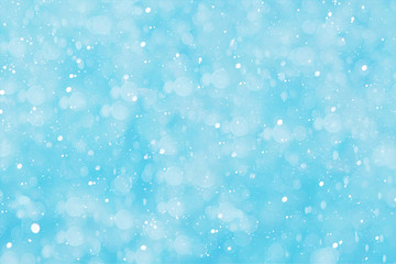Christmas background, abstract blue background with bokeh and snowflakes. Winter banner for your text.