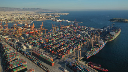 Fototapeta premium Aerial photo of industrial cargo container terminal in Perama and Drapetsona commercial port near Piraeus, Attica, Greece
