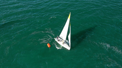Aerial drone photo of white Sailing boats compete during sailing regatta practise in open ocean exotic sea