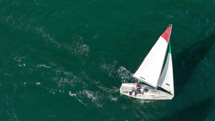 Aerial drone photo of white Sailing boats compete during sailing regatta practise in open ocean exotic sea