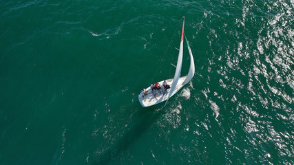Fototapeta premium Aerial drone photo of white Sailing boats compete during sailing regatta practise in open ocean exotic sea