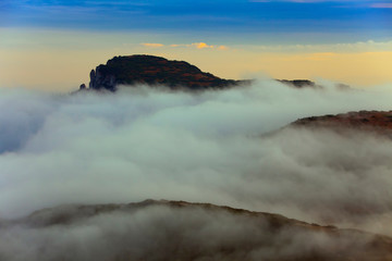 Obraz premium Ocolasul Mare peak 1907m above clouds. Romania