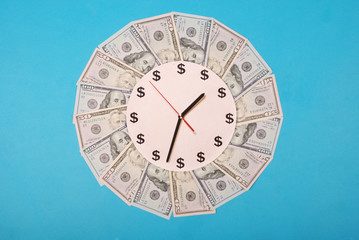 Concept of clock and dollar. Clock on kaleidoscope from money.