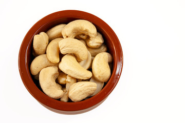 Cashews in a bowl on a white background