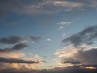 Dramatic clouds on bright blue sky.