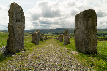 Standing stones lining gravel path