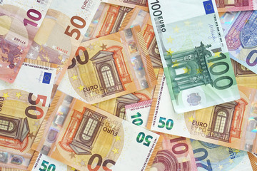 Background with money euro bills. Euro banknotes background. Business, finance, investment, saving and corruption concept.