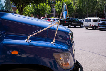 Fragment of a truck cab. Delivery of goods in the city.