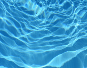 Surface of blue swimming pool,background of water in swimming pool. Water background blue.