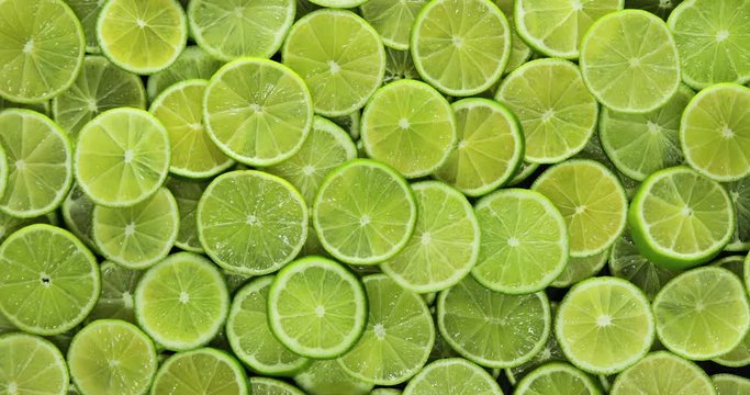 Background of sliced limes, slow zoom out and rotation