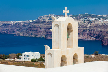 View of the Aegean sea and a traditonal bell tower from the ruins of the Castle of Akrotiri also...