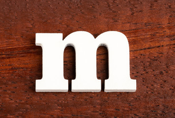 Lowercase letter m - Piece in wood