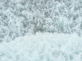 Abstract texture of water with waves. Top view of turquoise water as a background, ocean, sea, lake