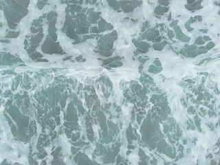 Abstract texture of water with waves. Top view of turquoise water as a background, ocean, sea, lake