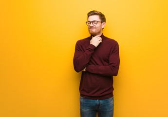 Fototapeta premium Young smart man coughing, sick due a virus or infection