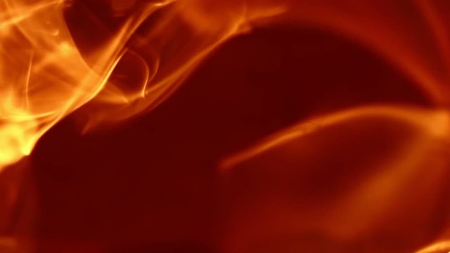Flames. This video captures a tight shot of flames dispersing.