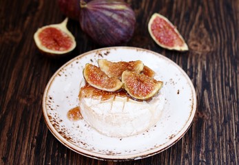 Baked Camembert cheese with figs .  copy space