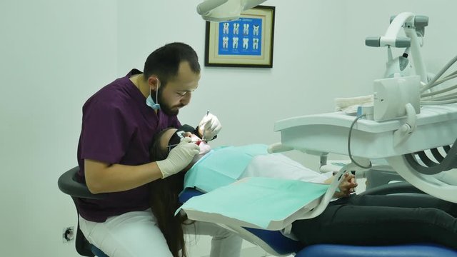 dentist doctor examines a woman patient   successful all good