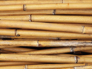 Bamboo wallpaper background.Long pieces of bamboo were laid horizontally. Stacks of wood