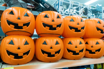 Plastic pumpkins buckets for sale in a store shelf