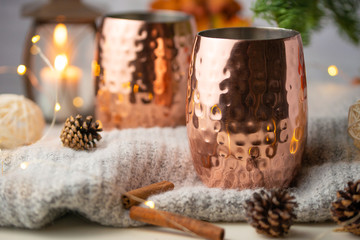 Two cups of hot drink on christmas background