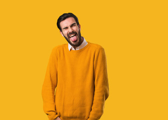 Young natural man funnny and friendly showing tongue