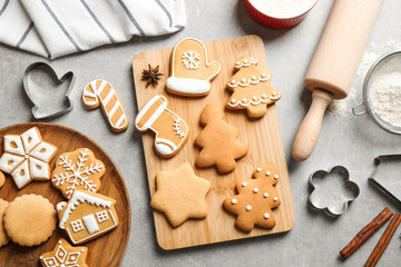 Flat lay composition with tasty homemade Christmas cookies on grey table