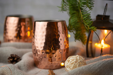 Two cups of hot drink on christmas background