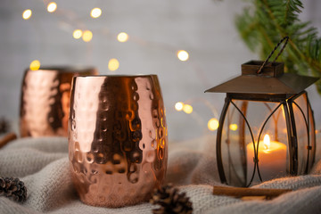 Two cups of hot drink on a Christmas background. Cold autumn. Atmosphere of home, warmth and comfort.