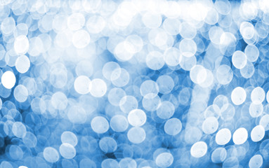 Blurred texture of glitter's paper. Festive background.