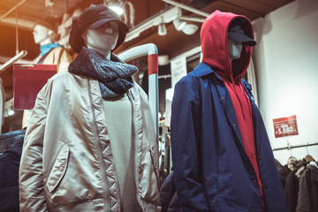 Clothes hipster winter fashion models in shopping center in boutique store. Fashionable for people...