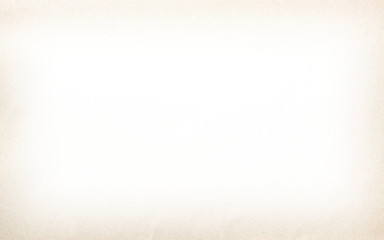 Old vintage paper with a glowing center and grunge vignette.