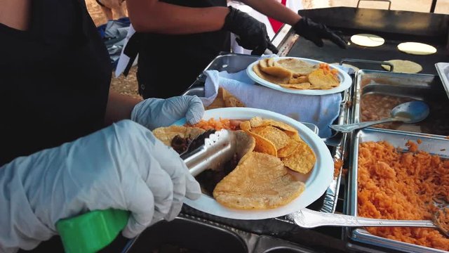 Fast food soft shell tacos being served for customer on a plate